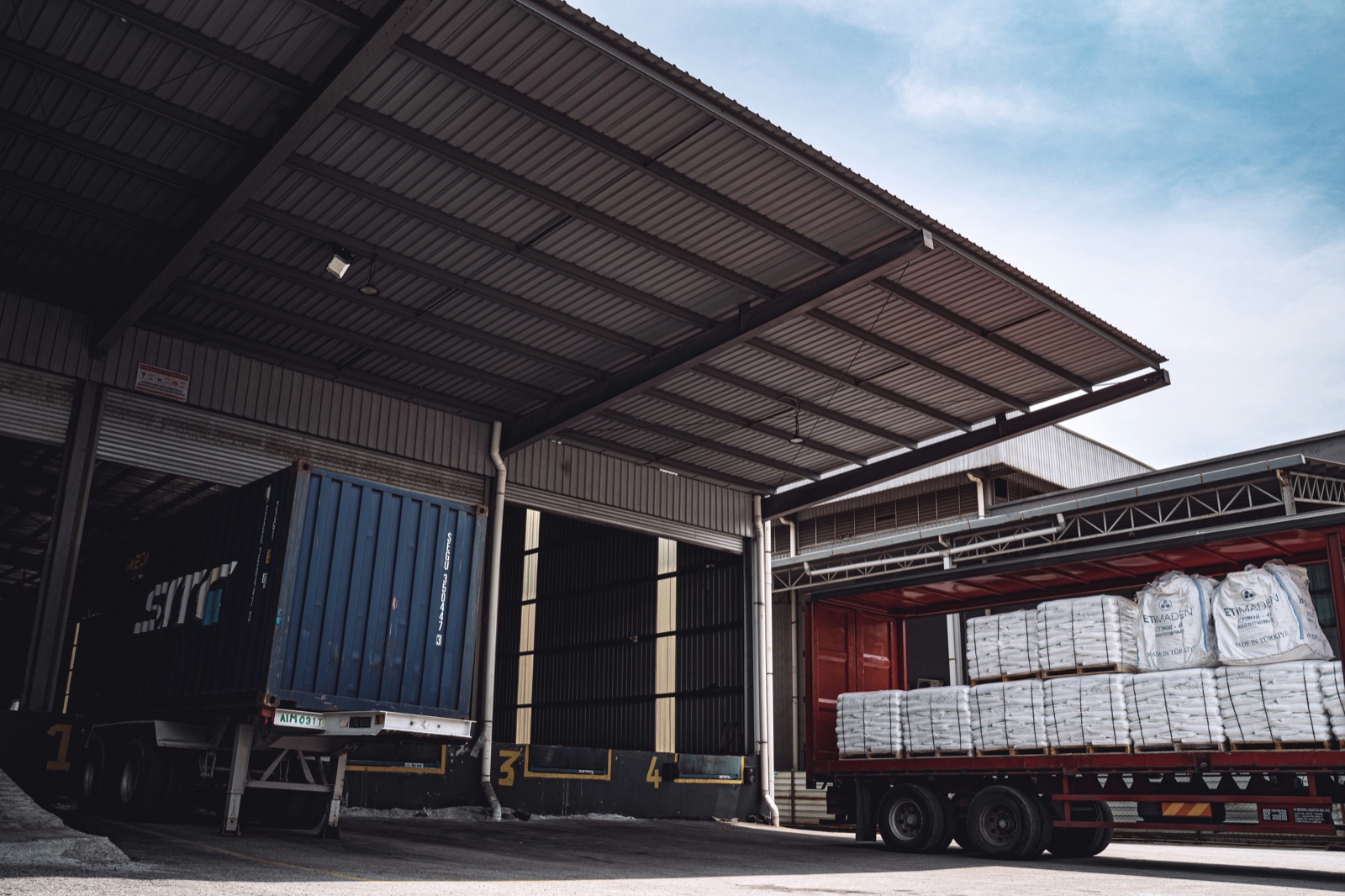 LTL trailer at a loading dock with palletized freight.